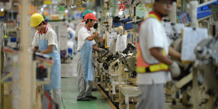 Indonesian workers work the assembly line of Toyota Motor's Indonesian unit, Toyota Motor Manufacturing Indonesia 