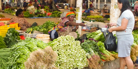 Woman selling vegetables in a market