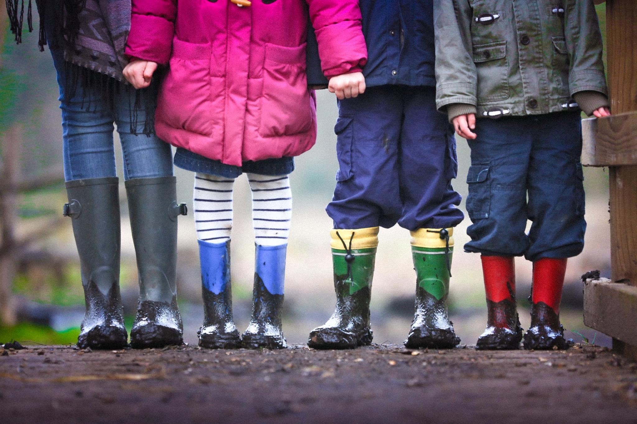 Children in gumboots from the shoudlers down