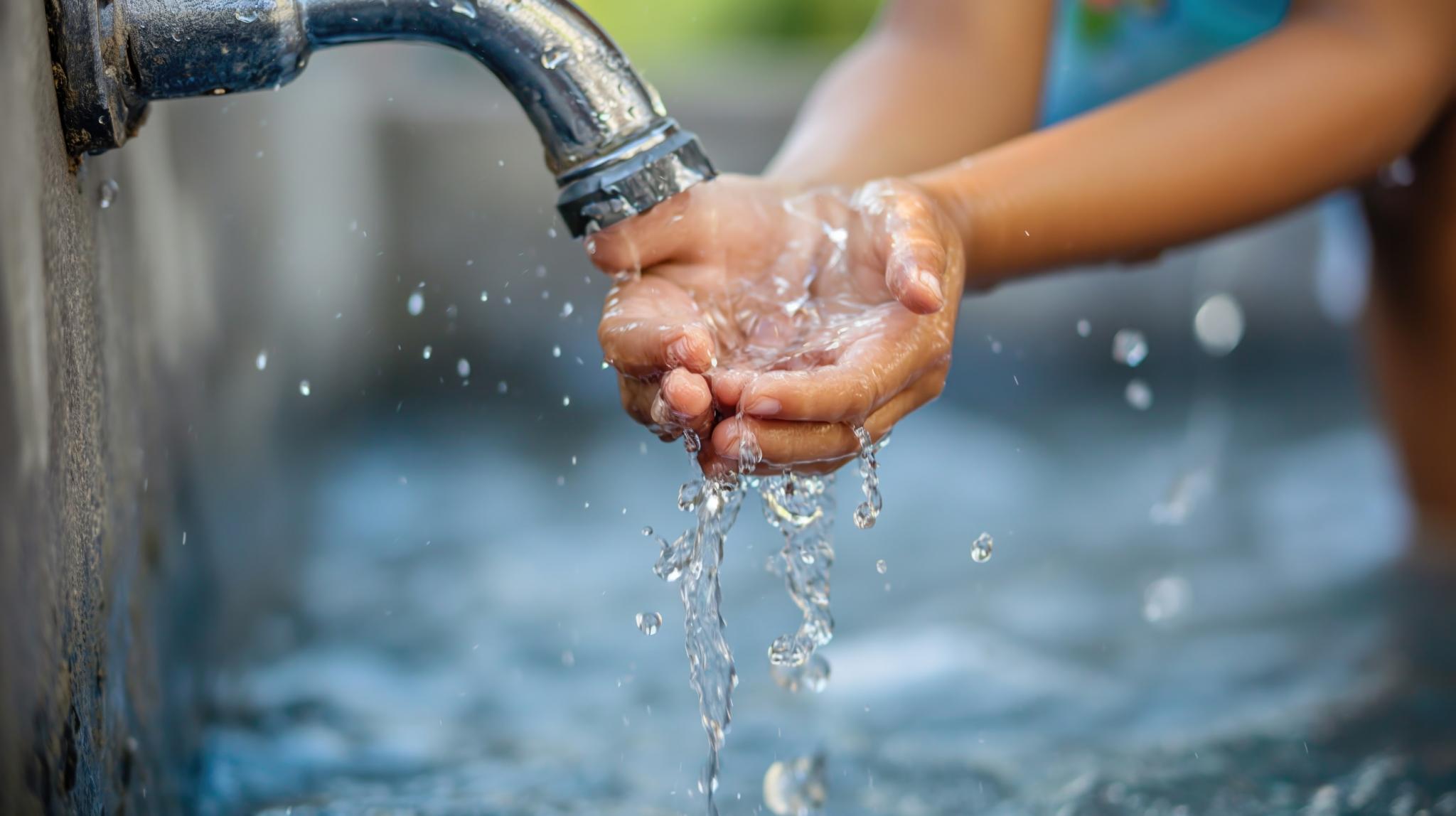 Rights to water running water tap and child's hands