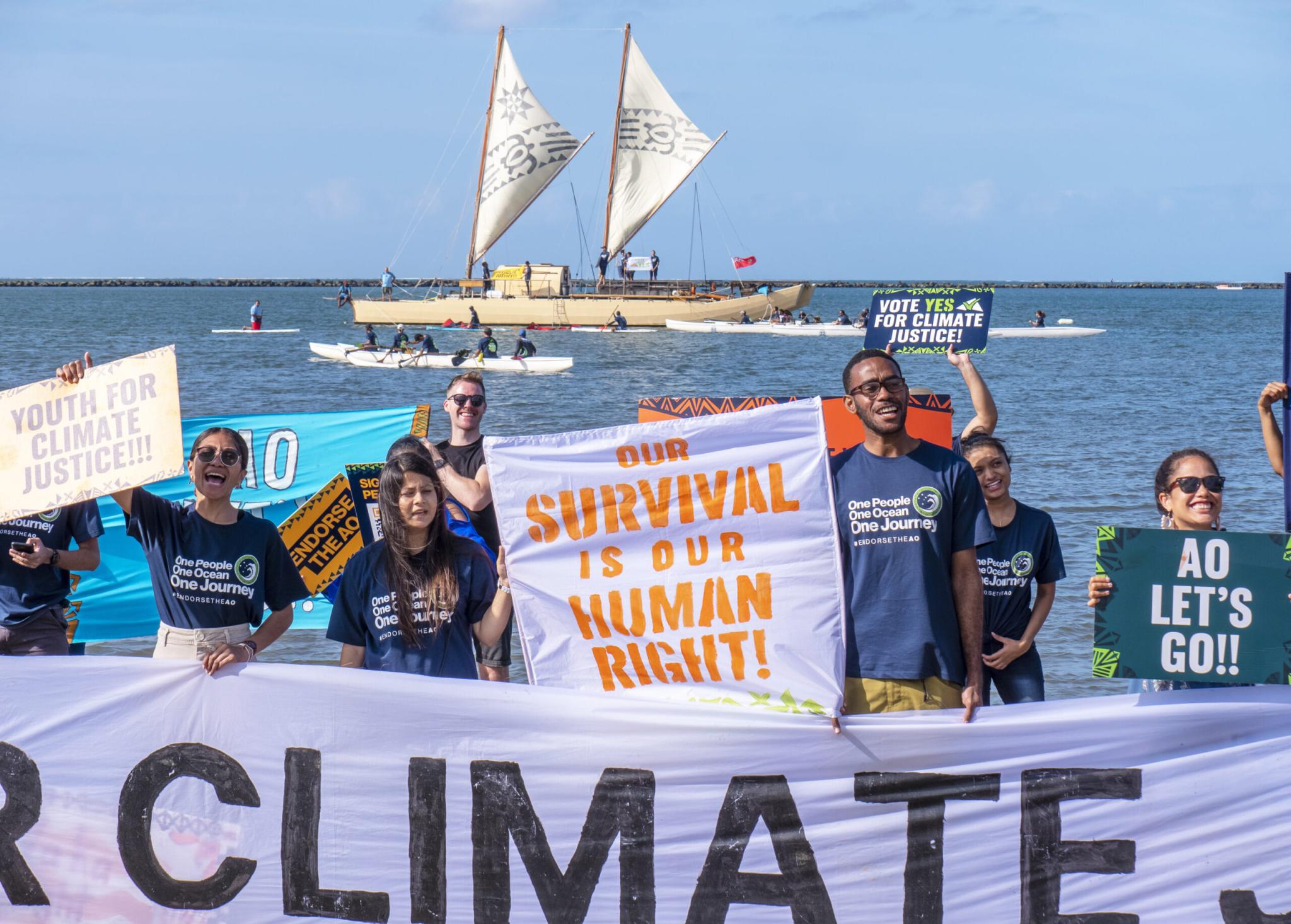 Pacific youth calling on leaders to support the climate justice campaign in the International Court of Justice at the University of South Pacific Lower Campus in Suva, 2022 (Pacific Islands Students Fighting Climate Change)