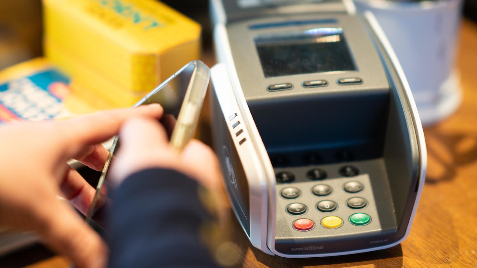 Photo by Tracey Nearmy, ANU Retail photo of person paying with eftpos