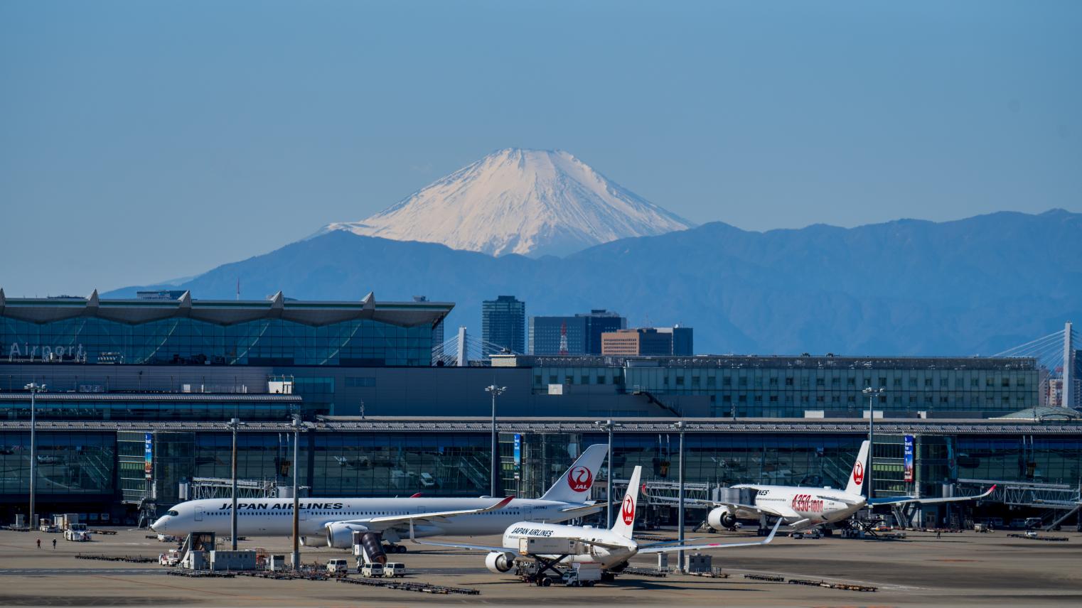 A bustling scene at Haneda Airport with airplanes and Mount Fuji in the background, Tokyo, Japan, 20 February 2025 (Photo: Guohua Song/Pexels).